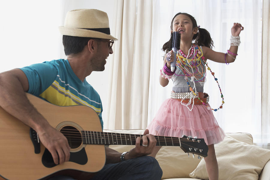 Caucasian father and daughter playing dress-up Photograph by Jose Luis Pelaez Inc