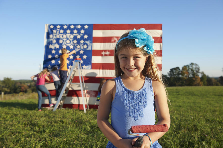 Caucasian girl painting American flag in field Photograph by LWA/Dann Tardif