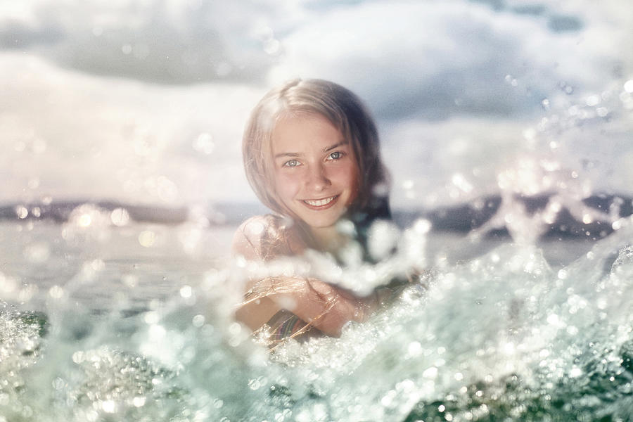 Caucasian girl splashing in lake Photograph by Vladimir Serov