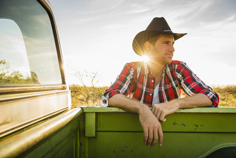 Caucasian man leaning on truck outdoors Photograph by Jacobs Stock Photography Ltd