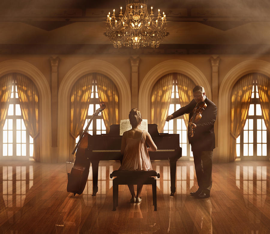 Caucasian musicians playing piano and violin Photograph by Colin Anderson Productions pty ltd