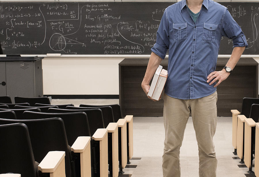Caucasian student standing in classroom Photograph by Hill Street Studios