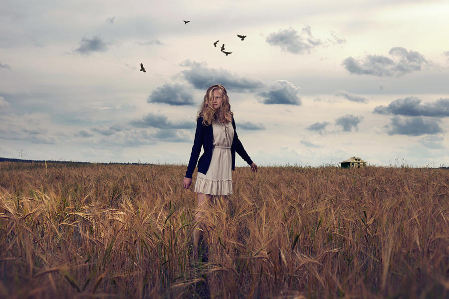 Caucasian teenage girl standing in field of tall grass Photograph by Vladimir Serov