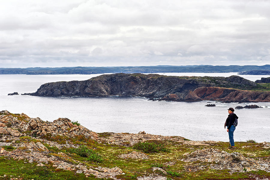 Caucasian woman admiring the scenery during a hike near Twillingate, Newfoundland,Canada Photograph by Brytta