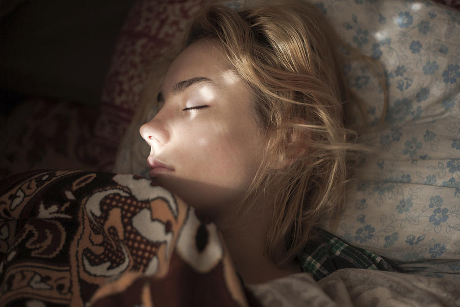 Caucasian woman sleeping in bed Photograph by Dmitriy Bilous
