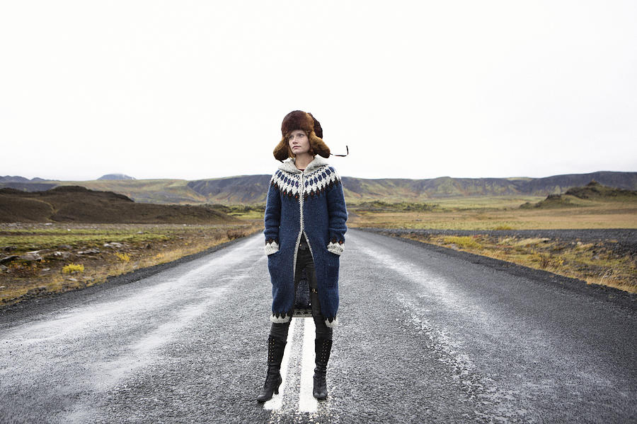 Caucasian woman standing in middle of road Photograph by Kyle Monk