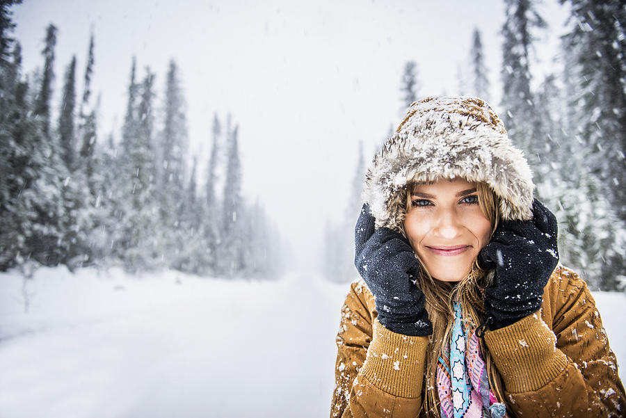 Caucasian woman wearing fur parka hood in snow Photograph by Jacobs Stock Photography Ltd