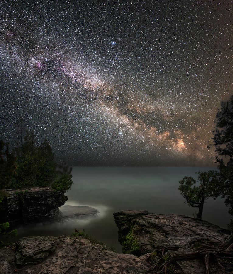 Cave Point Dreams - Milky Way over Lake Michigan at Cave Point Park Photograph by Peter Herman
