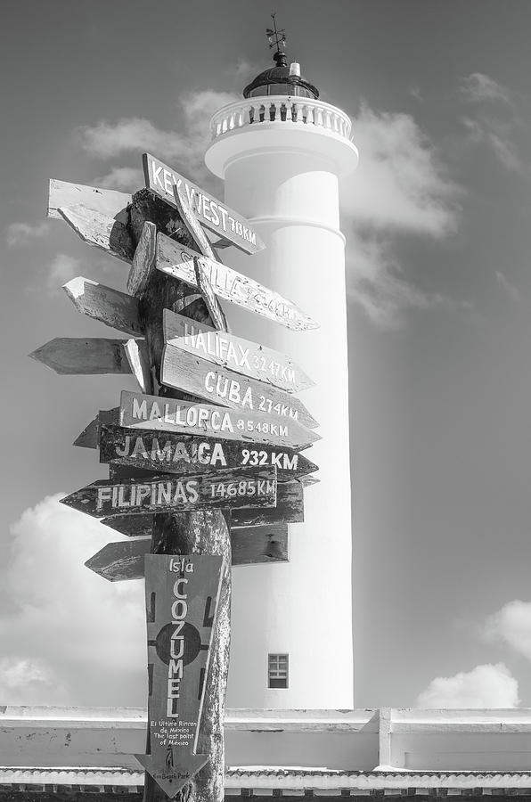 Celarain Lighthouse and Directional Sign Post at Punta Sur Eco Park Cozumel Mexico Black and White Photograph by Shawn OBrien