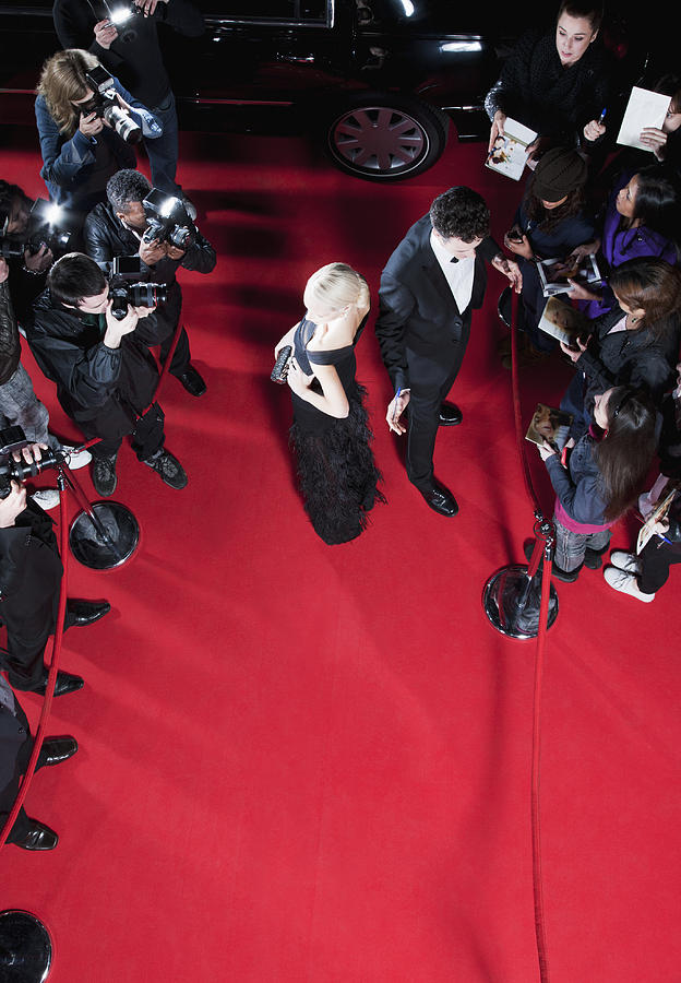 Celebrities working on red carpet Photograph by Tom Merton