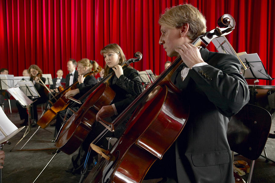 Cellists Performing in an Orchestra Photograph by Digital Vision.
