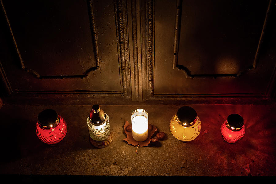 Cemetery Candle Lights At The Old Tomb Doors Photograph by Artur Bogacki