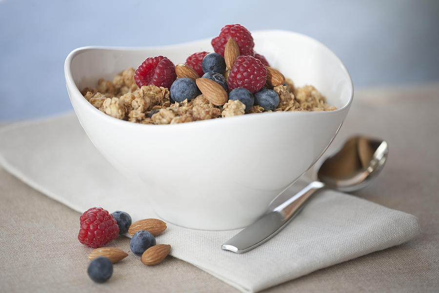 Cereal with berries and nuts Photograph by Tammy Hanratty