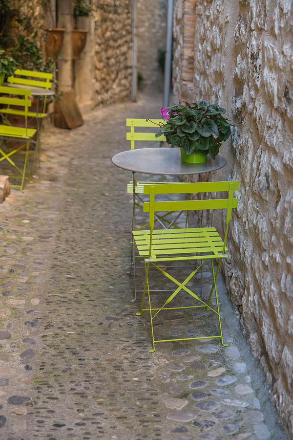 Chairs and tables on a typical villages street Photograph by Jean-Marc PAYET