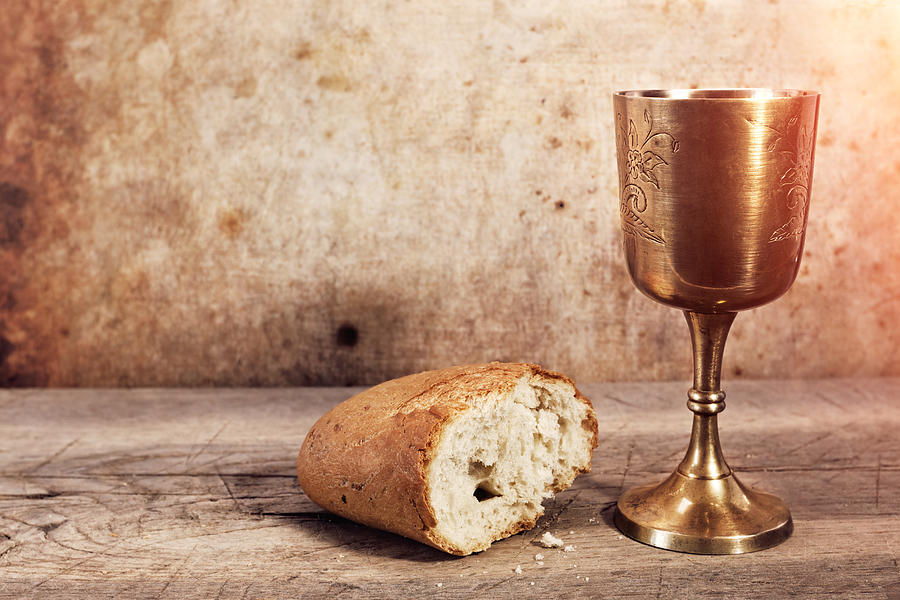 Chalice with wine and bread. Photograph by Avalon_Studio