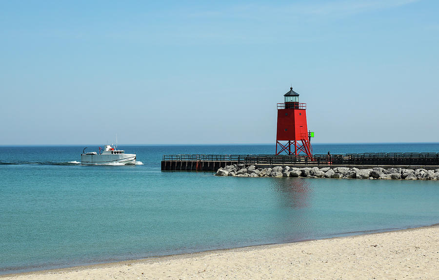 Charlevoix Michigan Lighthouse And Boat Photograph by Dan Sproul