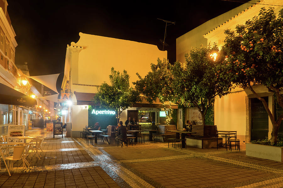 Charming Faro Algarve Portugal - Nighttime Dining Under Orange Trees Photograph by Georgia Mizuleva