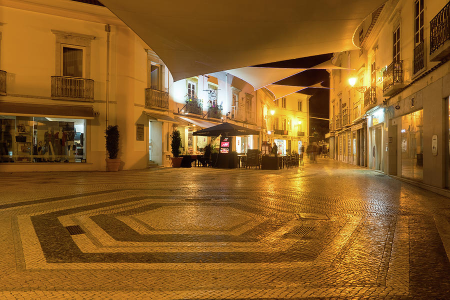Charming Faro Algarve Portugal - Nighttime Shopping Street with a Cool Pentagon Calcada Pattern Photograph by Georgia Mizuleva