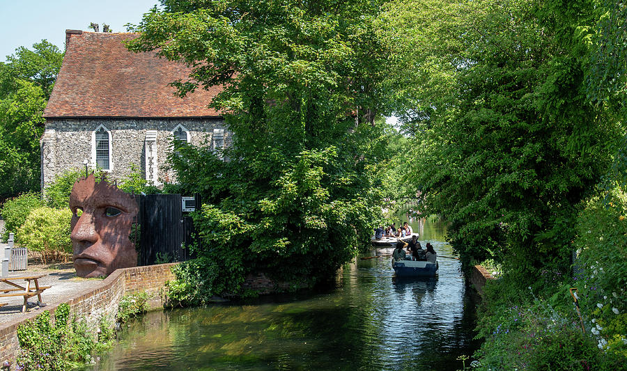 Chartham gardens with tourist People taking a romantic boat ride in the canal of the river stour. Photograph by Michalakis Ppalis