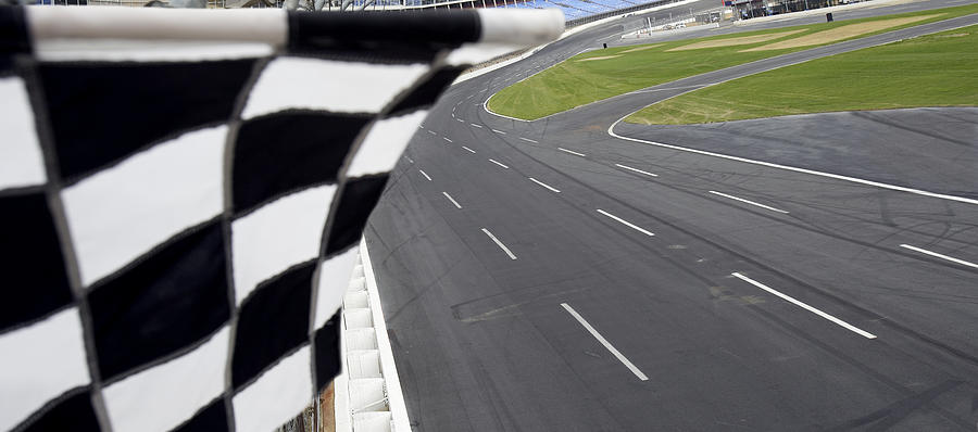 Checkered flag and motor speedway Photograph by Nycshooter