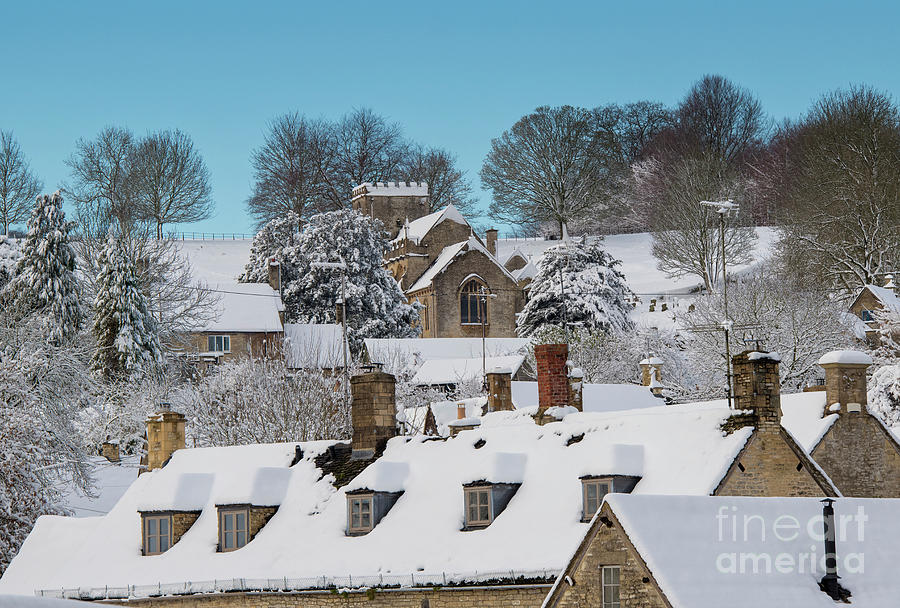 Chedworth Village Church and Rooftops in the December Snow Photograph by Tim Gainey