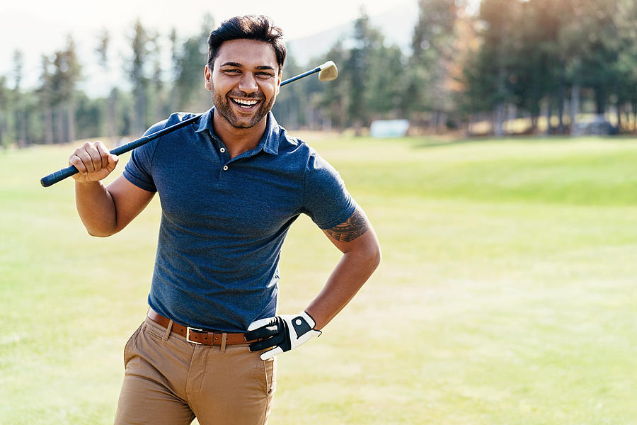 Cheerful golf player Photograph by Pixelfit