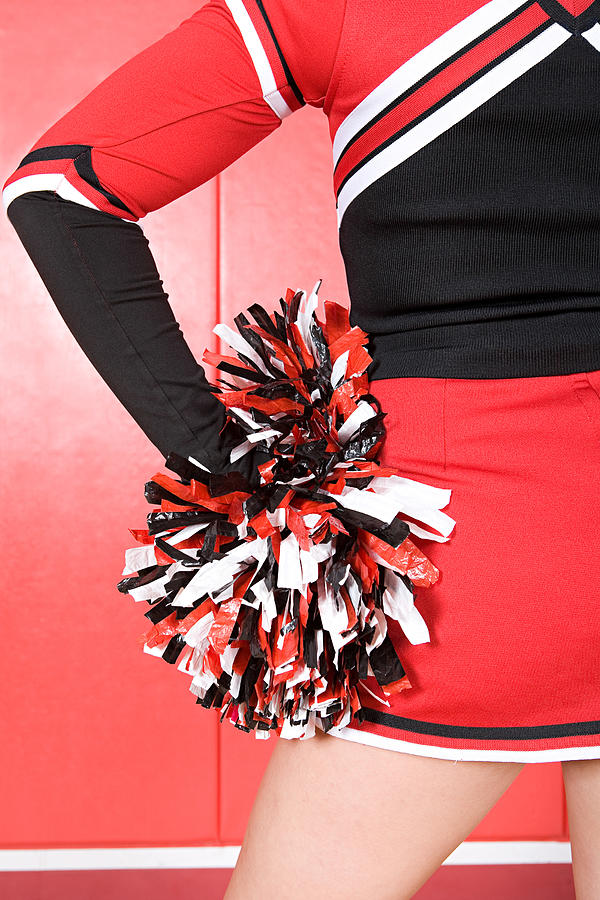 Cheerleader with pom pom Photograph by Image Source