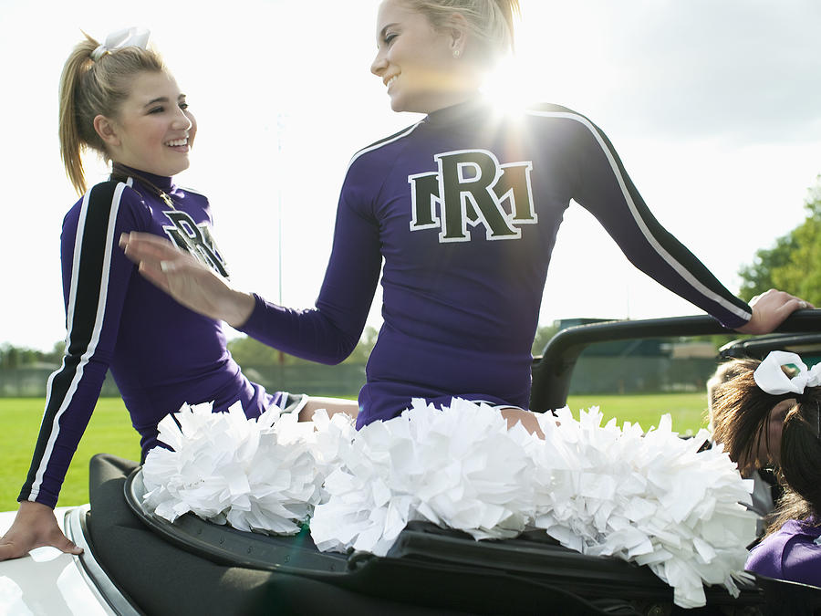 Cheerleaders Riding in Car Photograph by Tony Anderson
