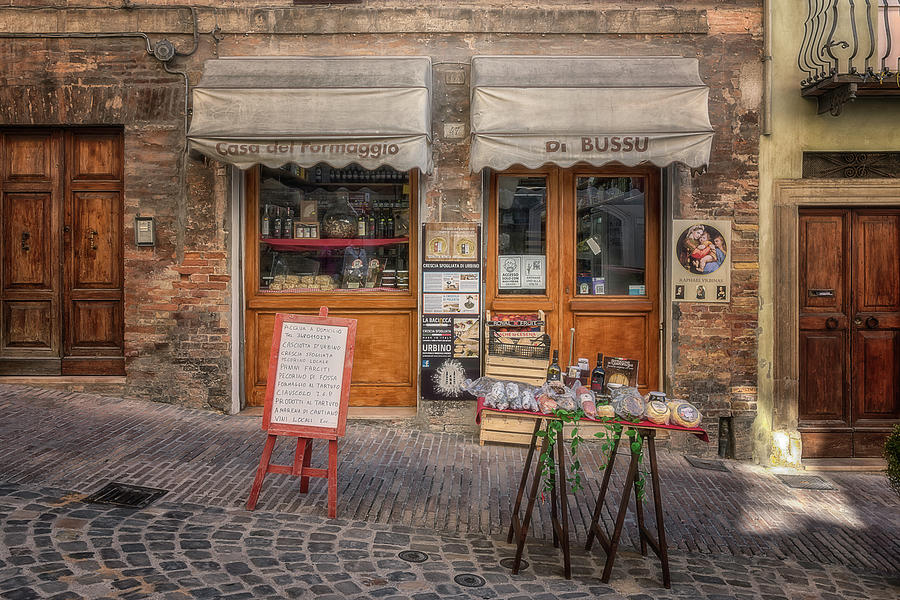 Cheese store in Urbino Photograph by Wolfgang Stocker