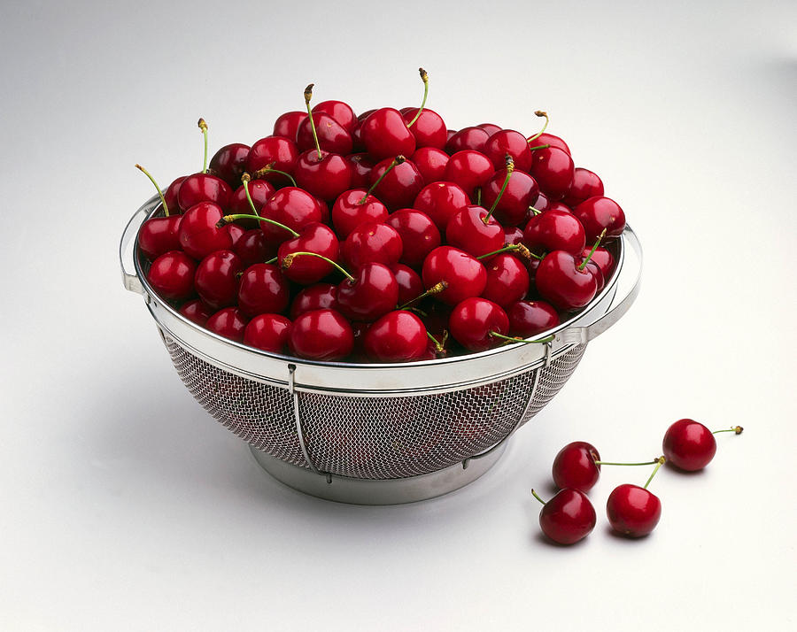 Cherries in colander Photograph by Jackson Vereen