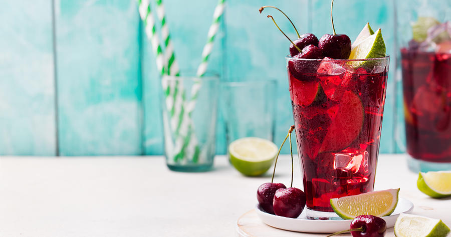Cherry Limeade, lemonade, cola, cocktail in glass. Photograph by AnnaPustynnikova