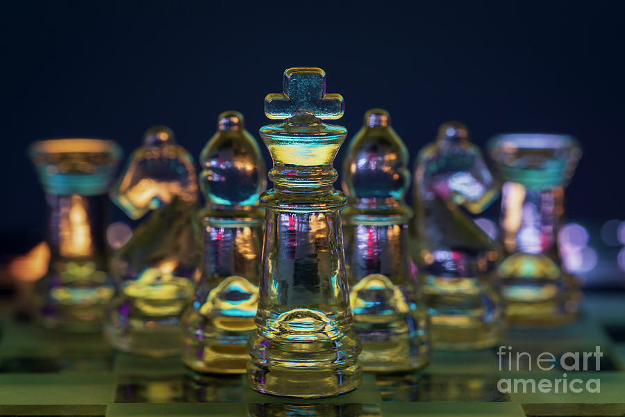 Chess figures made of glass. King in front black background macro Photograph by Pablo Avanzini