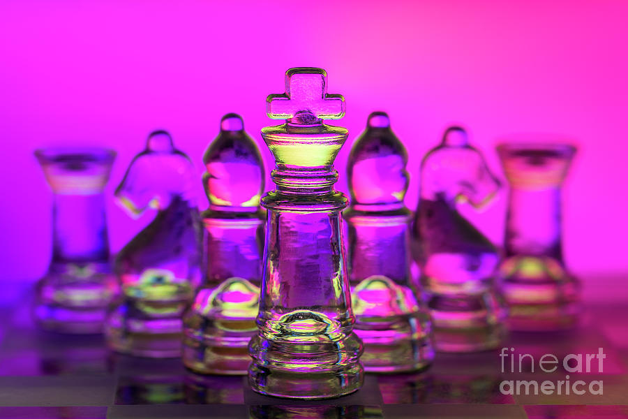 Chess figures made of glass. King in front magenta background macro Photograph by Pablo Avanzini