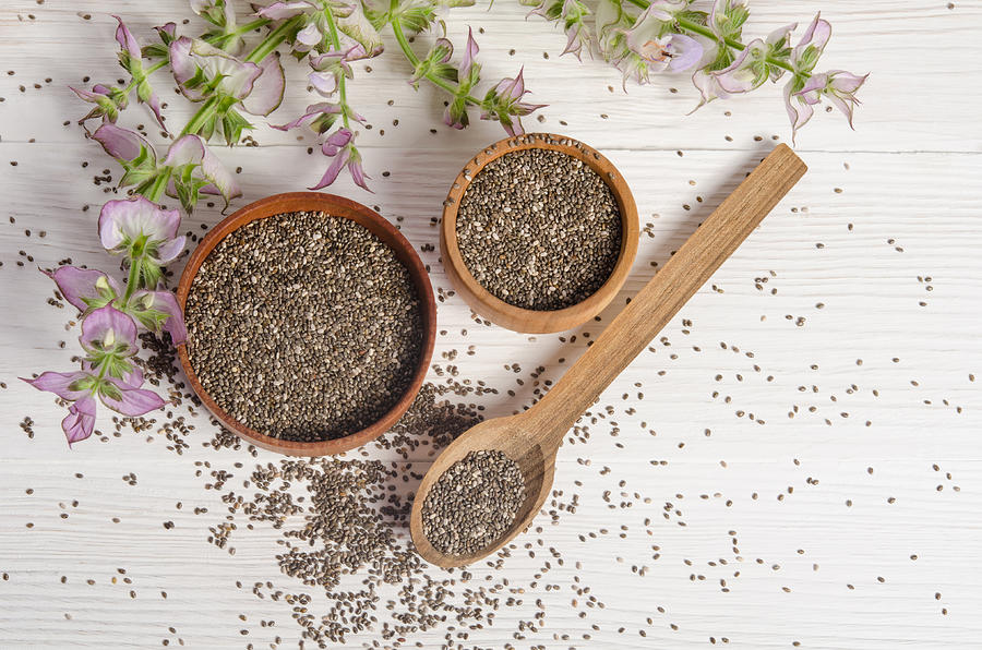 Chia seed healthy super food with flower over white Photograph by White_caty