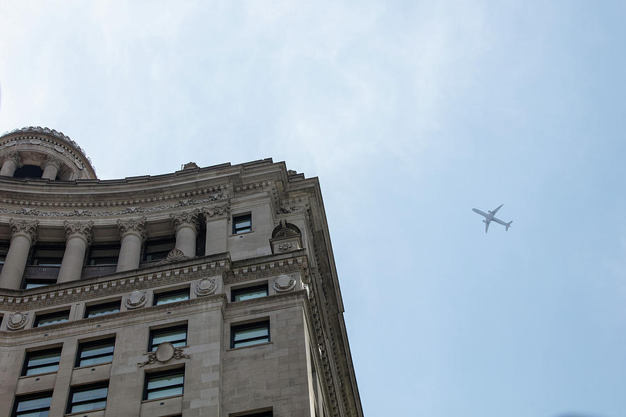Chicago looking up at Plane  Photograph by John McGraw