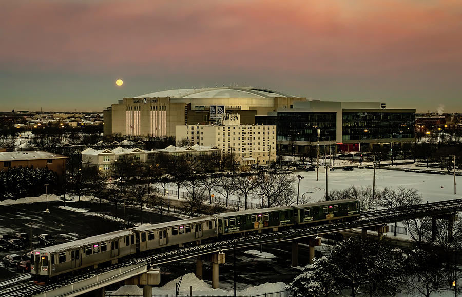 Chicagos United Center with setting full moon Photograph by Sven Brogren