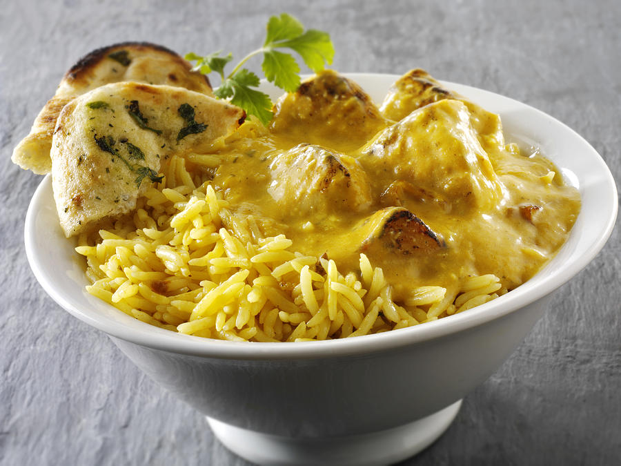 Chicken Passanda curry, pilau rice and naan bread Photograph by Paul Williams - Funkystock