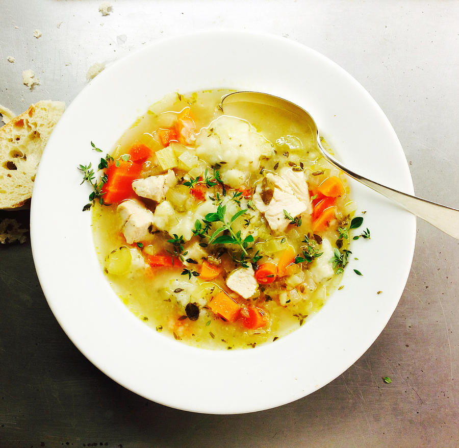 Chicken soup with thyme and crusty bread Photograph by Bill Boch