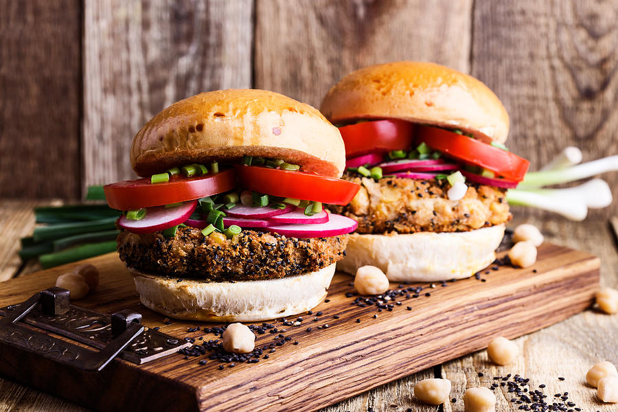 Chickpea veggie burger with fresh vegetables Photograph by Istetiana