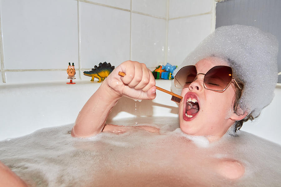 Child singing in bubble bath Photograph by Keep It 100