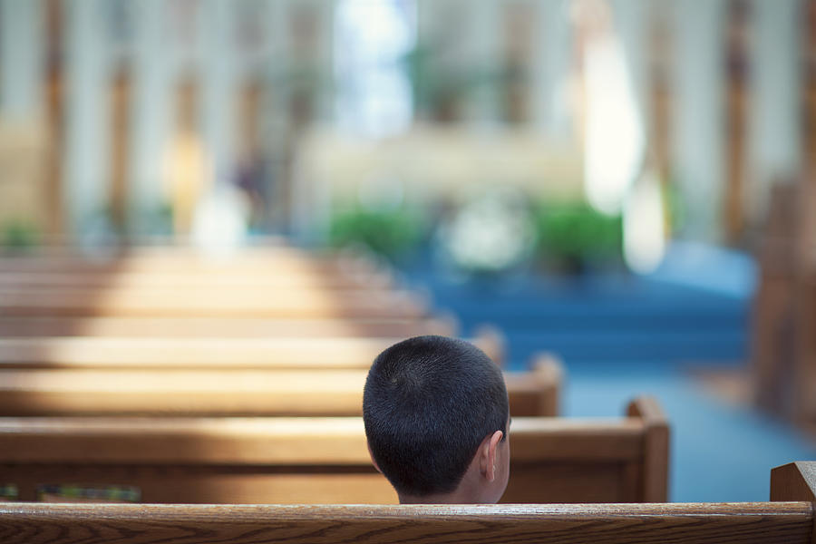Child Sitting Alone In Church Photograph by Allen Donikowski