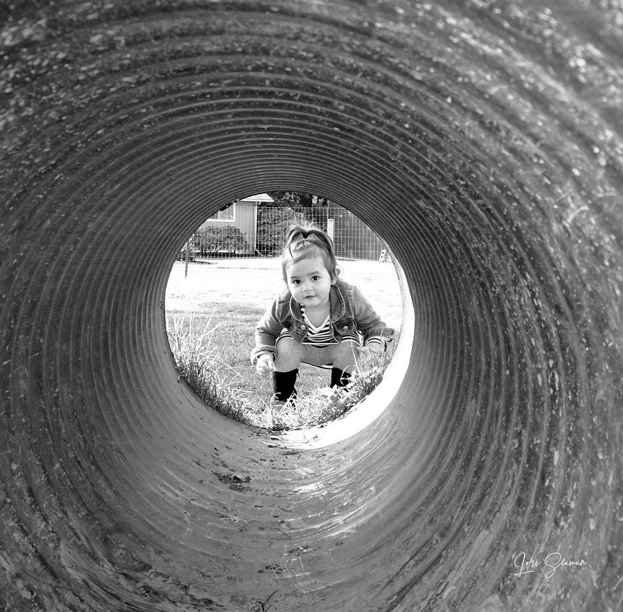 Child Through A Tube Photograph by Lori Seaman