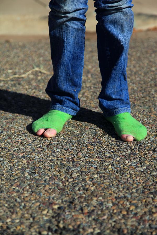 Child wearing green socks with holes Photograph by D. Sharon Pruitt Pink Sherbet Photography