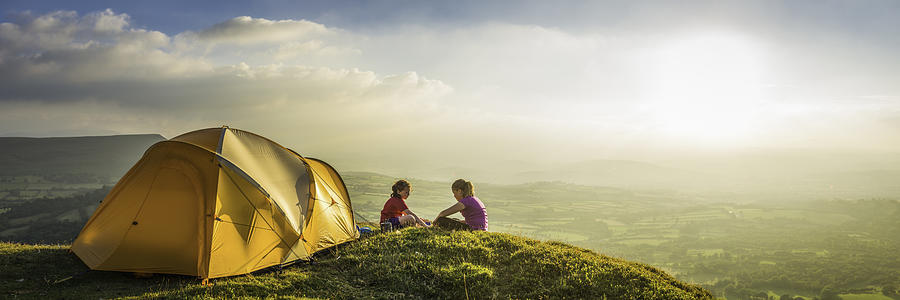 Children camping on idyllic summer sunset mountain light panorama Photograph by fotoVoyager