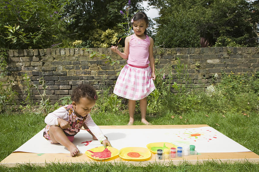 Children Painting in the garden Photograph by Thomas Odulate