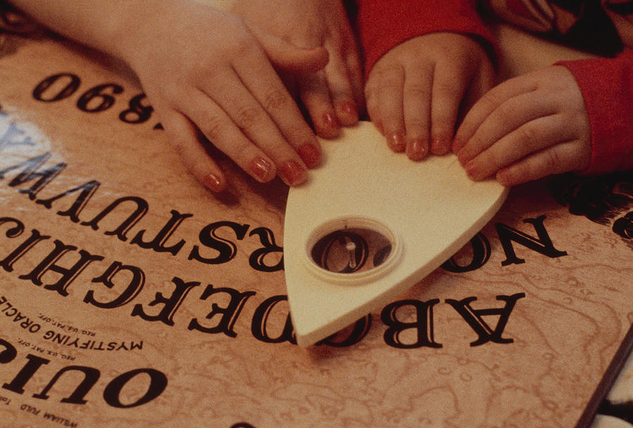 Children Play with Ouija Board Photograph by Ellen Denuto