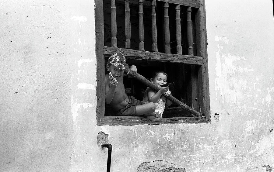 Children playing at the window in Trinidad Photograph by RicardMN Photography