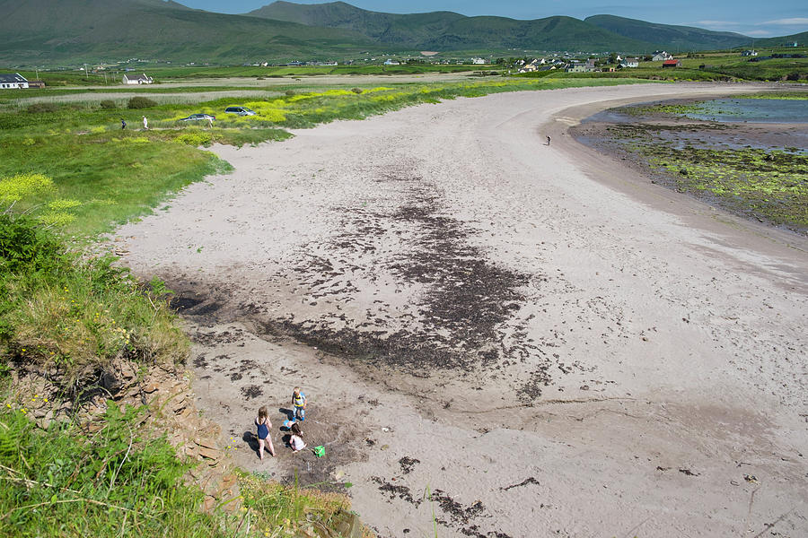 Children playing on sandy beach at Feohanagh Photograph by David L Moore