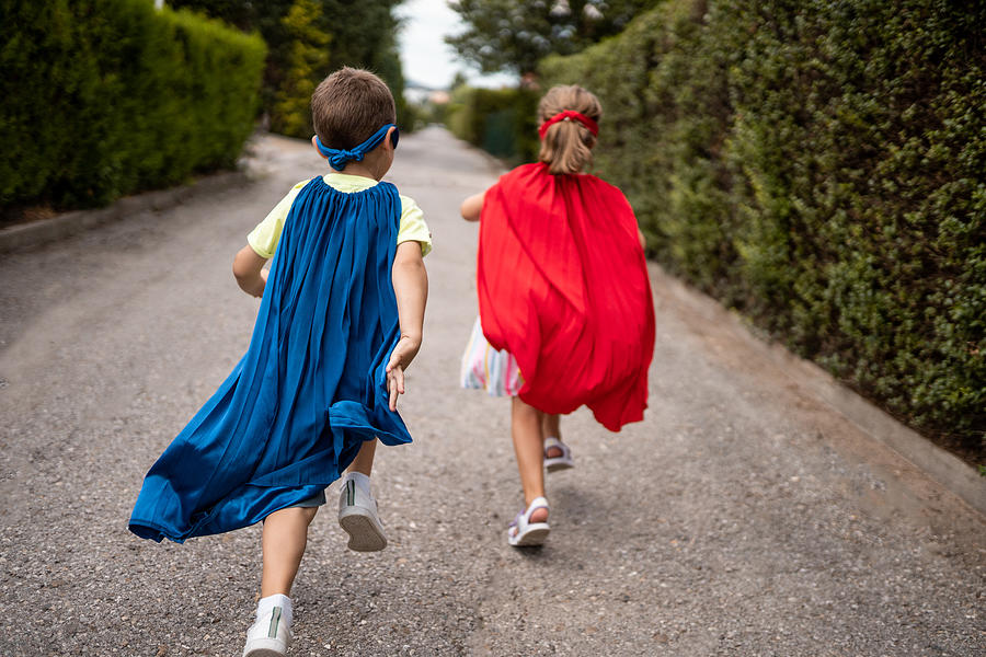 Children pretending to be superheroes Photograph by Freemixer