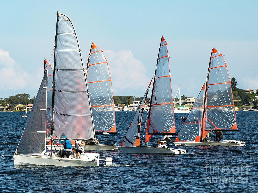 Children Sailing, class racing in 29er dinghies in a high school Photograph by Geoff Childs